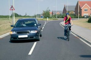 That's right, use the other lane to pass (c/ UK Road Cycling Laws)